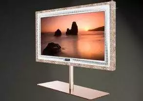 A luxurious tv stand featuring a picture of a sunset, perfect for a wealthy consumer.