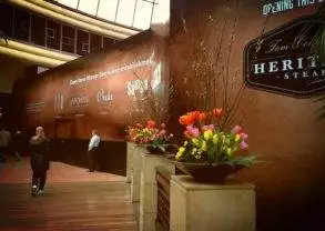 Tom Colicchio's Heritage Steak is a Las Vegas restaurant with flowers and a sign that says Herbert's Steakhouse.