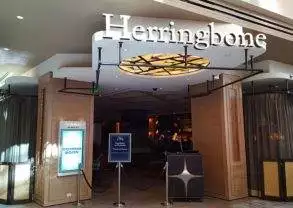 Herringbone: A restaurant with a sign that says herringbones in Las Vegas, Nevada.