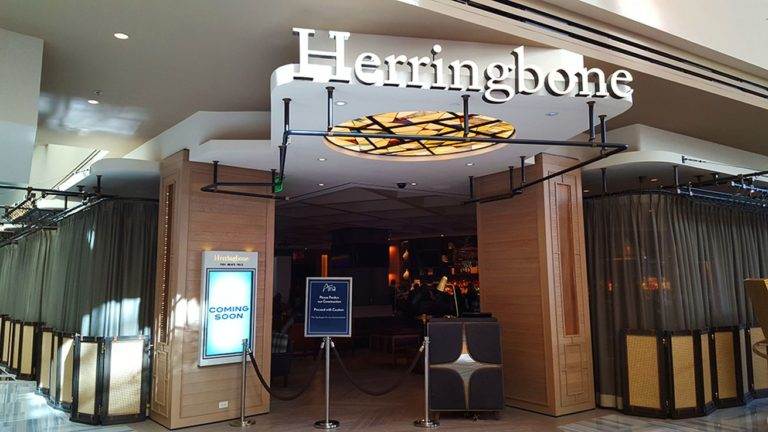 Herringbone: A restaurant with a sign that says herringbones in Las Vegas, Nevada.