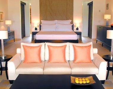A room with couches and a coffee table in the Carlisle Bay.