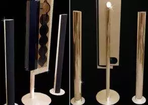 A set of gold and black speakers.