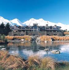 A luxurious lake surrounded by breathtaking mountains.