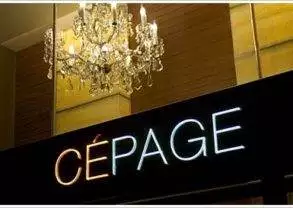 A neon sign displaying the word "cepage" combines oriental elegance with modern lighting.