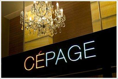 A neon sign displaying the word "cepage" combines oriental elegance with modern lighting.
