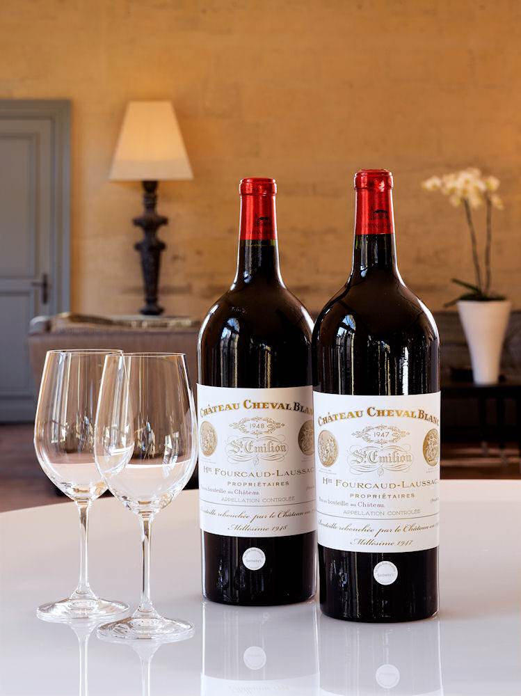Expensive bottles of wine on a table.