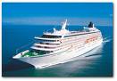 A large white cruise ship in the ocean, offering luxurious dining experiences with exquisite wine and food onboard, courtesy of Crystal Cruises.