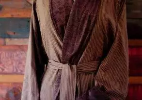 A brown striped robe on a wooden mannequin sold by Telegraph Hill Luxury Robes.