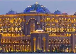 Emirates Palace hotel in Abu Dhabi at dusk.