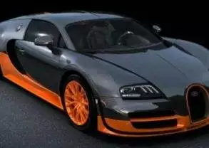 An orange and black Bugatti Veyron is parked on a luxurious black background.