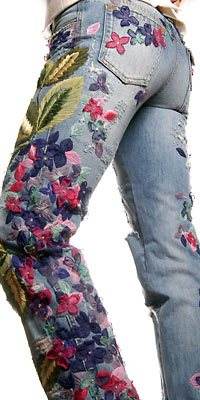 A woman wearing floral jeans.