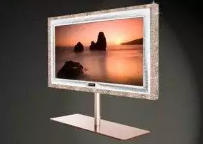 A tv stand with a picture of a sunset designed by Stuart Hughes.