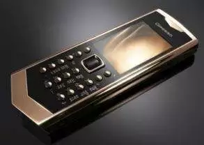 A gold and black cell phone from the Avantgadre Collection.