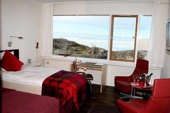 Beds in a room at Arctic hotel.