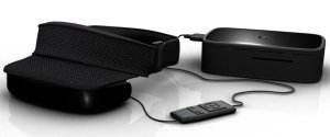 Black electronic eye mask with a wired controller and a connected rectangular device, all on a white background—a sleek accessory that could easily fit into Inspector Gadget’s collection of the best travel gadgets.