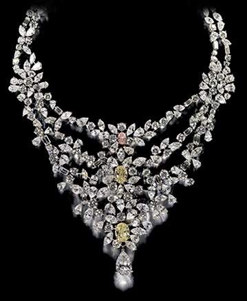 A necklace with diamonds and pearls on a black background featuring an Empress's Charm.