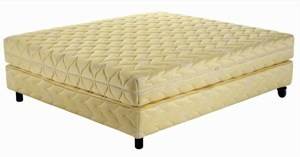 A yellow ottoman on a white background.
