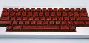 A red and silver keyboard on a white surface with a price of $4,240.