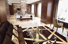 A living room with brown and black furniture at Hotel Okura Amsterdam.