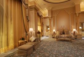 An ornate bedroom with an ornate ceiling in the 