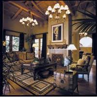 A luxury retreat in Phoenix, Arizona featuring a living room with a large chandelier.
