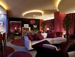 A living room with a vibrant red and white color scheme, perfect for a vacation getaway.