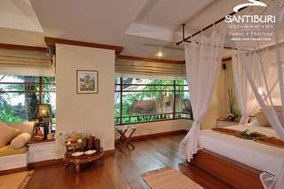 A heavenly bedroom with a canopy bed.