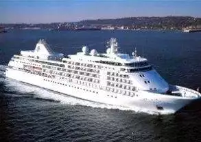 A luxurious cruise ship, Silver Whisper, gliding on the vast ocean.