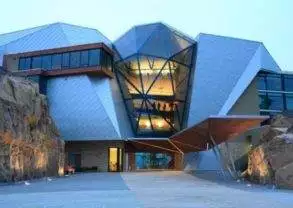 A building that looks like it is made out of rocks.
Keywords: Sparkling Hill Resort rock-themed architectural wonder.