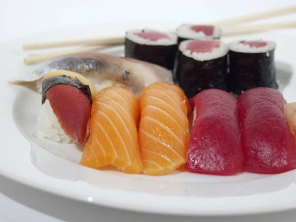 A plate of sushi and chopsticks at Sushi District in Toronto.