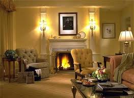 Yellow walls and a fireplace in the Presidential Suite at the Taj Boston offer ultimate luxury.