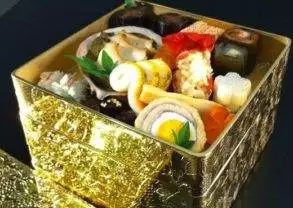 A gold lunch box filled with Osechiriyori priced at $234,000.