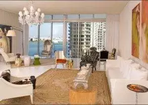 An urban living room with a view of the ocean from Viceroy Miami.